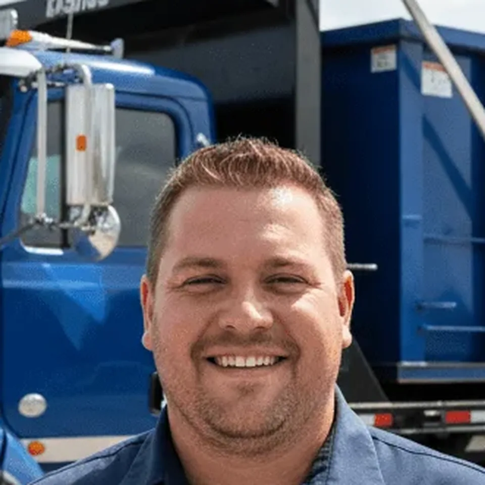 Marcus Green — Lead Driver, BFT Dumpster Rental Beaufort Marcus Green, Lead Driver at BFT Dumpster Rental Beaufort, standing in front of a company truck